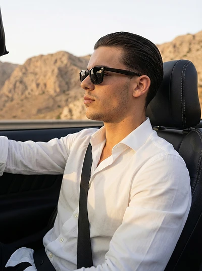 Male AI influencer driving sports car